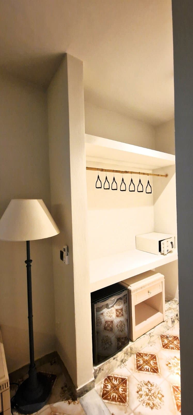 Wardrobe nook with safe and fridge